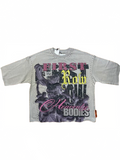 Gray t-shirt with graphic design and text on a white background